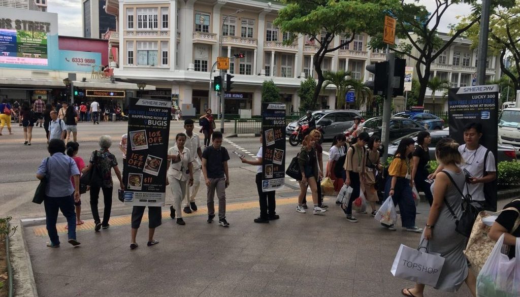 Hand-to-Hand Marketing in Singapore’s Busiest Spots with Street Flyer Distribution Promo